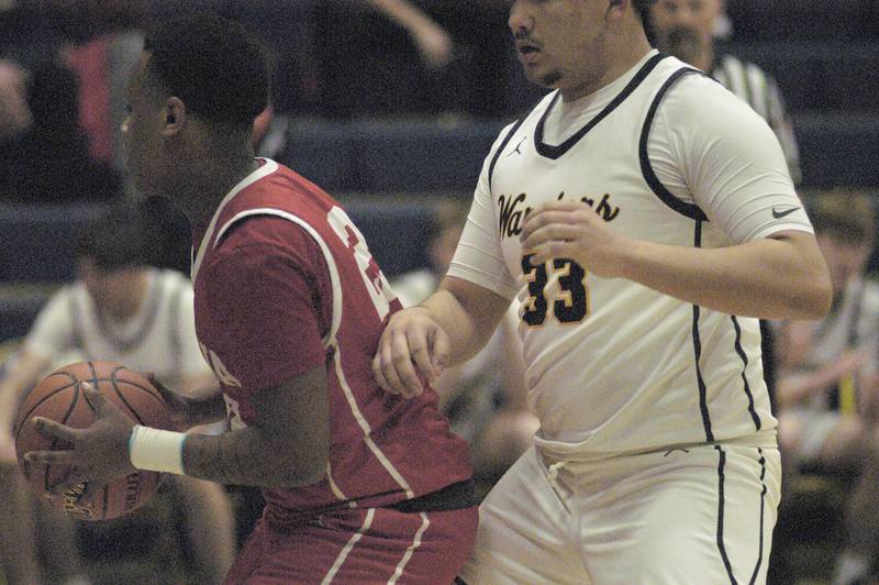 An Ottawa player is blocked by Sterling's Maddux Osborn during Sterling’s 3A Regional semifinal game Wednesday, Feb. 21, 2024, at Sterling High School.