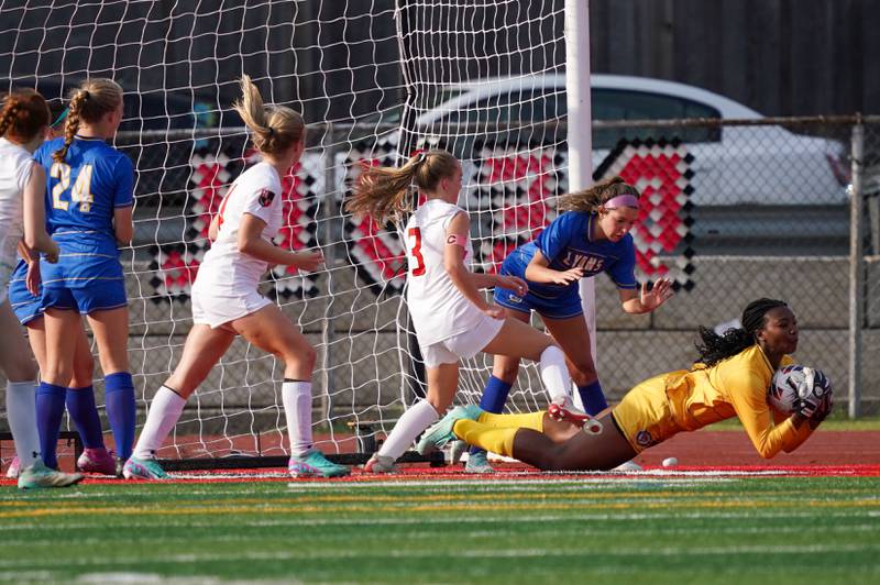 Lyons’ Nora Ezike (1) makes a diving save against Hinsdale Central during a Class 3A Hinsdale Central Sectional semifinal soccer match at Hinsdale Central High School in Hinsdale on Tuesday, May 21, 2024.