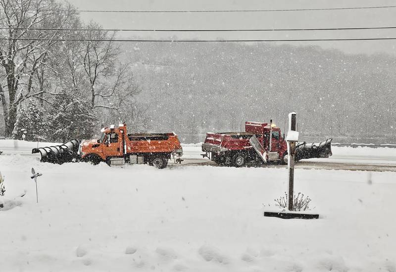 Many regional roads remain impassable Friday morning as a winter storm travels across northern Illinois. Here, a township plow truck slid off the road along state Route 2 north of Oregon and had to be pulled back onto the roadway by another plow truck. County officials continue to advise motorists stay off the roads. Blizzard conditions are forecast for later in the evening.