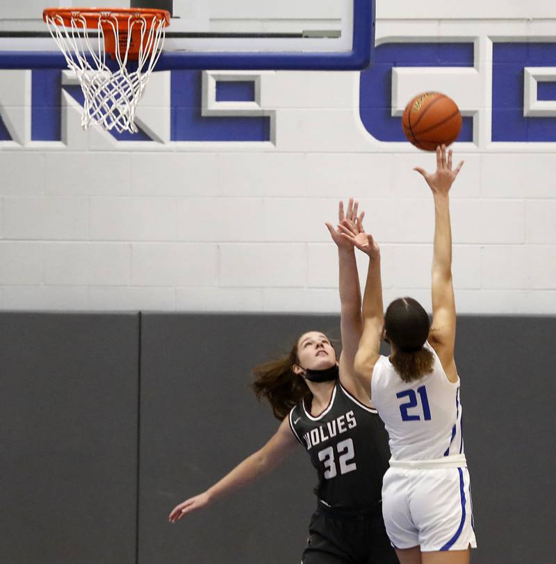 Prairie Ridge's Kelly Gende tries to block the shot of Burlington Central's Taylor Charles during Fox Valley Conference girls basketball game Monday evening, Jan. 31 2022, between Prairie Ridge and Burlington Central at Burlington Central High School.