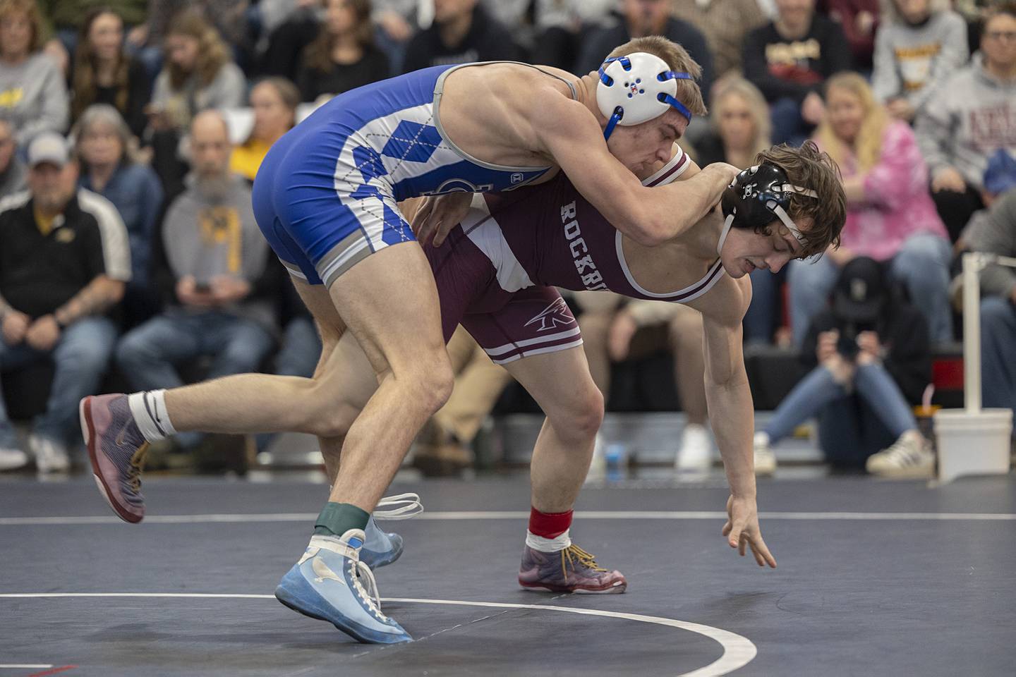 Newman’s Brady Grennan works against Rockridge’s Jude Finch at 132 pounds Saturday, Feb. 3, 2024 during the class 1A Fulton wrestling regionals.