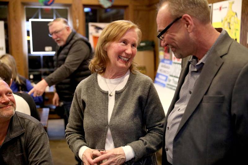 Barbara Wojnicki, candidate for Campton Hills village president, talks with trustee candidate Timoth Morgabn at the Old Towne Pub in Campton Hills as they await election results following the Consolidated Election on Tuesday, April 4, 2023.