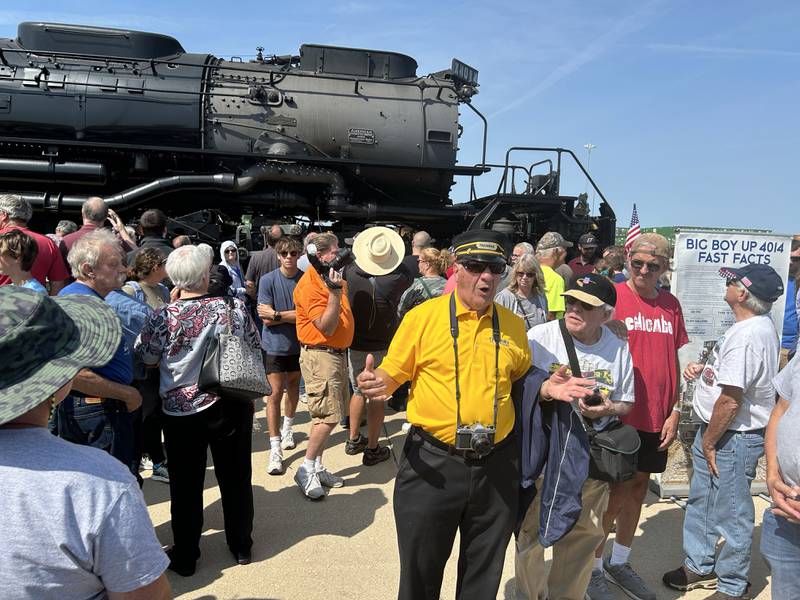 A man talks about the history of Union Pacific's Big Boy 4014 vintage steam locomotive on Sunday, Sept. 8, 2024. An estimated 61,000 people visited the steam locomotive at the UP Global II terminal during the daylong, free event in Rochelle..