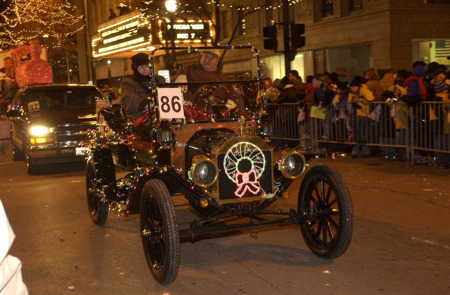 Decorated vintage car drives in the 2003 Joliet Christmas parade.