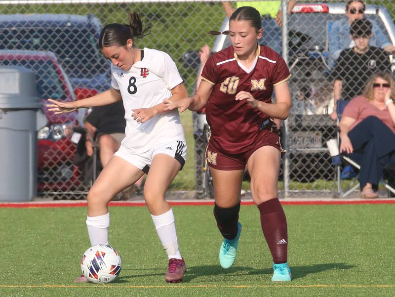 L-P's Faith Gonzalez keeps the ball away from Morris's Joria Ferrell during the Class 2A Regional semifinal game on Wednesday, May 15, 2024 at the L-P Athletic Complex in La Salle.