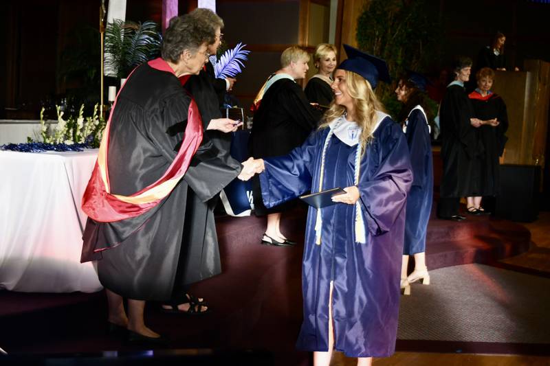 Nazareth Academy graduate Sara Mazur receives congratulations from Sr. Pat Bergen, CSJ during the school’s commencement ceremony at Christ Church in Oak Brook on Sunday, May 19, 2024.