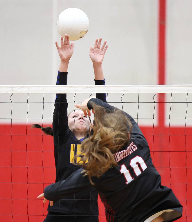 Somonauk's Josie Rader tries to block the spike of Indian Creek's Audrey Witte during their regional first round match Tuesday, Oct. 25, 2022, at Aurora Christian High School in Aurora.