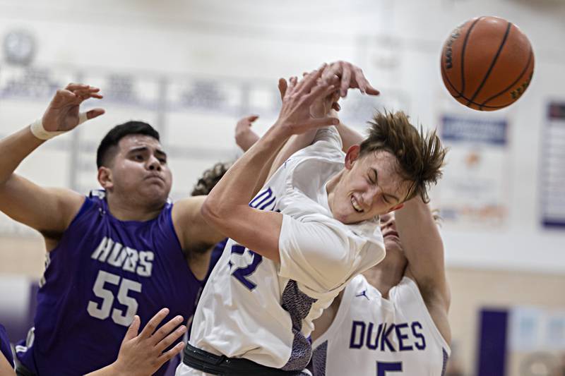 Dixon’s Bryce Feit and Rochelle’s Raul Aguirre fight for the ball Monday, Dec. 5, 2022.