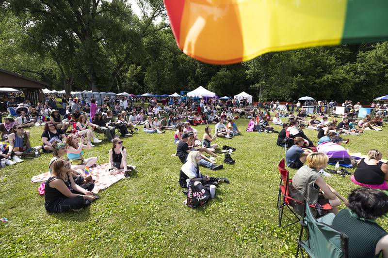 Fans sit on the lawn of Page Park on Saturday, June 15, 2024, at Dixon Pride Fest.