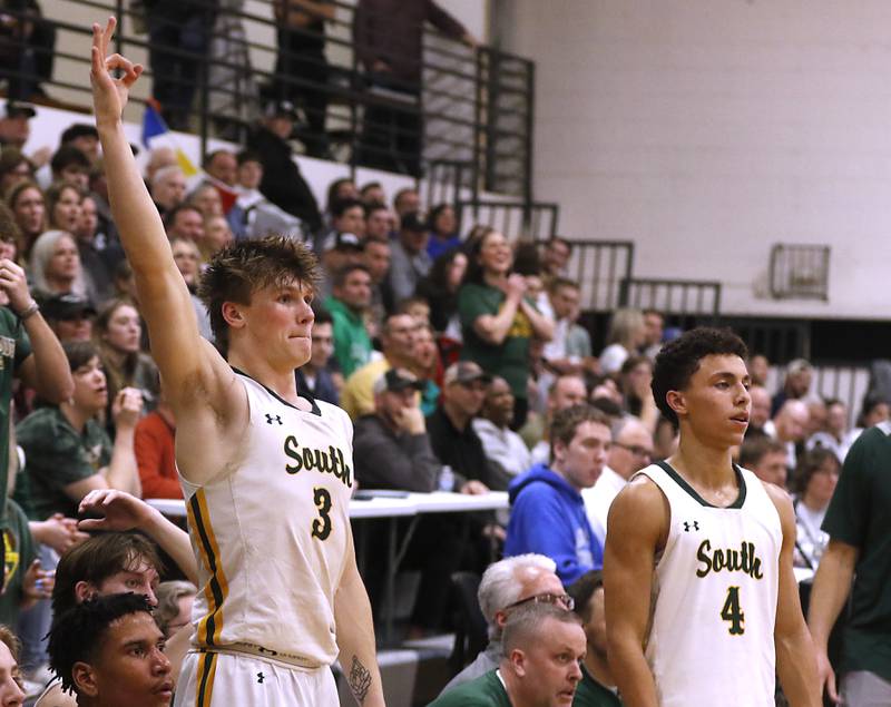 Crystal Lake South's Colton Hess and Crystal AJ Demirov celebrate a teammate’s three-point-shot during the IHSA Class 3A Kaneland Boys Basketball Sectional championship game against Kanelandon Friday, March 1, 2024, at Kaneland High School in Maple Park.
