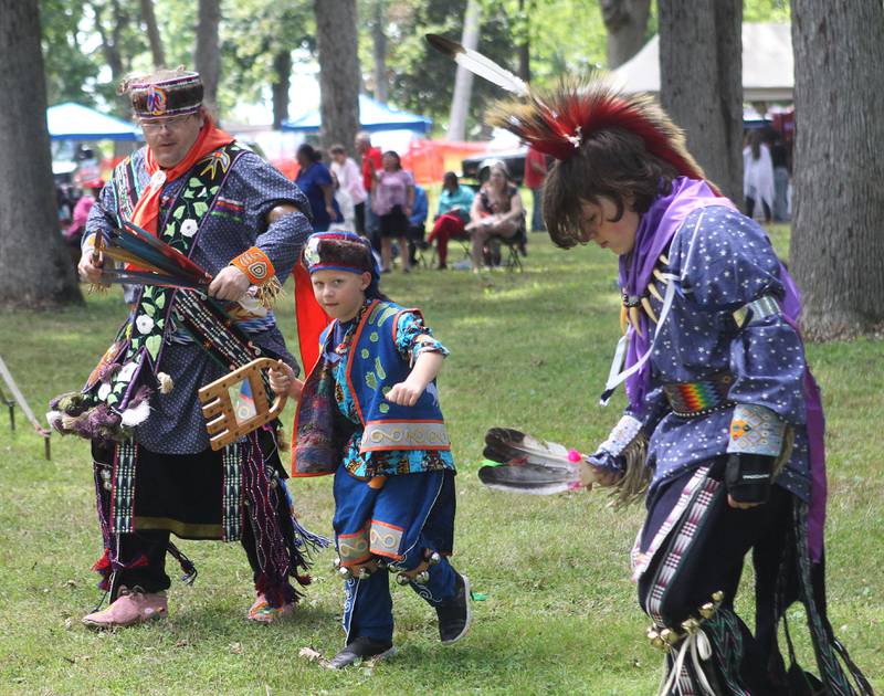 David Ray Armstrong, of Minneapolis, Minn., and his sons, Isaiah, 7, and Ezekiel, 13, dance to an intertribal song during the 30th Annual Potawatami Trails Pow-Wow at Shiloh Park on Saturday, August 26th in Zion. 
Photo by Candace H. Johnson for Shaw Local News Network