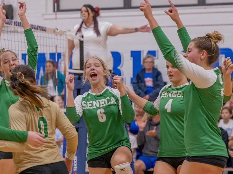 Seneca athletes celebrate the winning set point and forcing a third set against Newark Community High School on September 9, 2024.