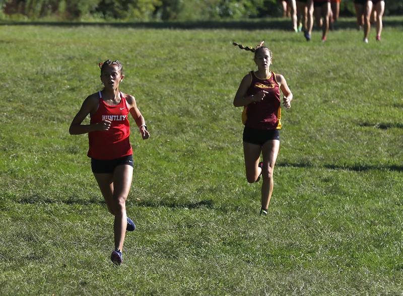 Huntley’s Haley Rahman pulls away from Richmond-Burton’s Alexia Spatz as they compete in the girls race of the McHenry County Cross Country Invite on Saturday, August 31, 2024, at McHenry Township Park in Johnsburg.