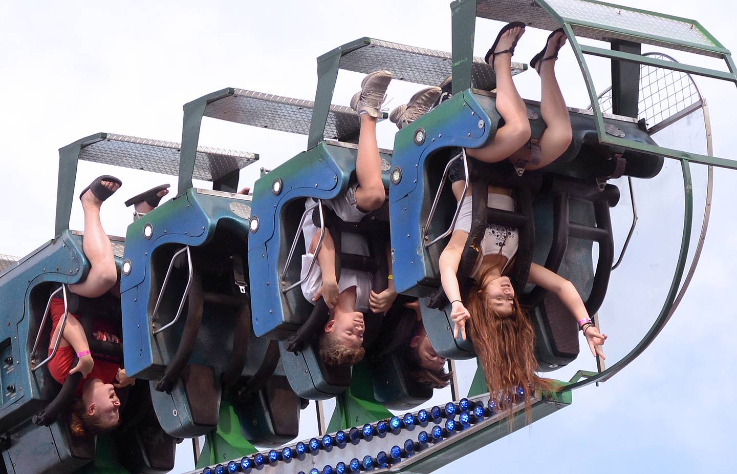 Riders of "The Screamer" get turned upside down while enjoying the ride at the Streator Fourth of July carnival at Northpoint Plaza in 2019.