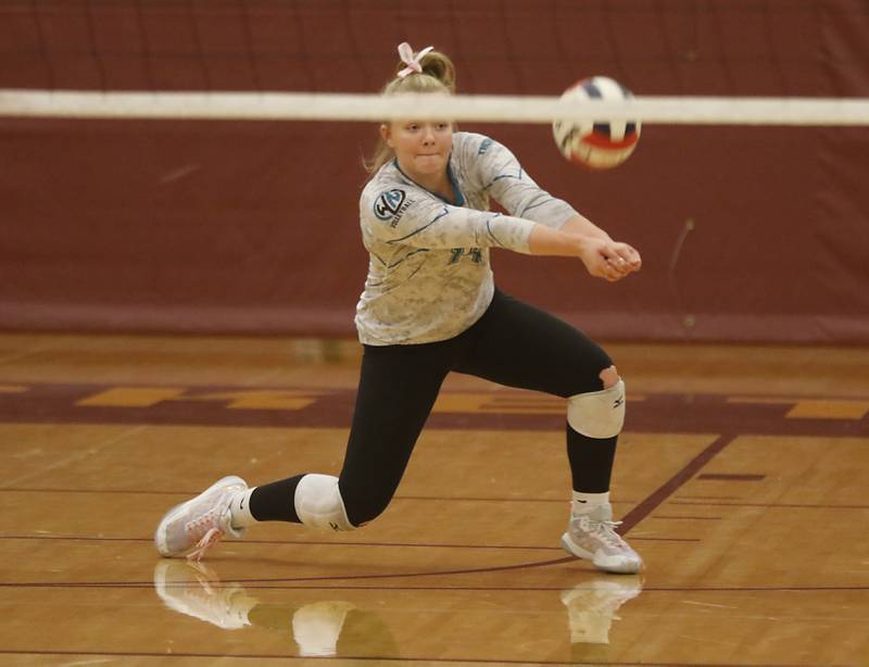 Woodstock North’s Devynn Schulze tries to pass the ball during a Kishwaukee River Conference volleyball match against Richmond-Burton Wednesday, Oct.11, 2023, at Richmond-Burton Community High School.