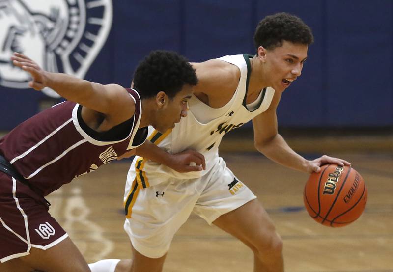 Crystal Lake South's AJ Demirov pushes the ball up the court against Wheaton Academy's Wandy Munoz during the IHSA Class 3A Cary-Grove Boys Basketball Regional Championship game on Friday, Feb. 23, 2024 at Cary-Grove High School.