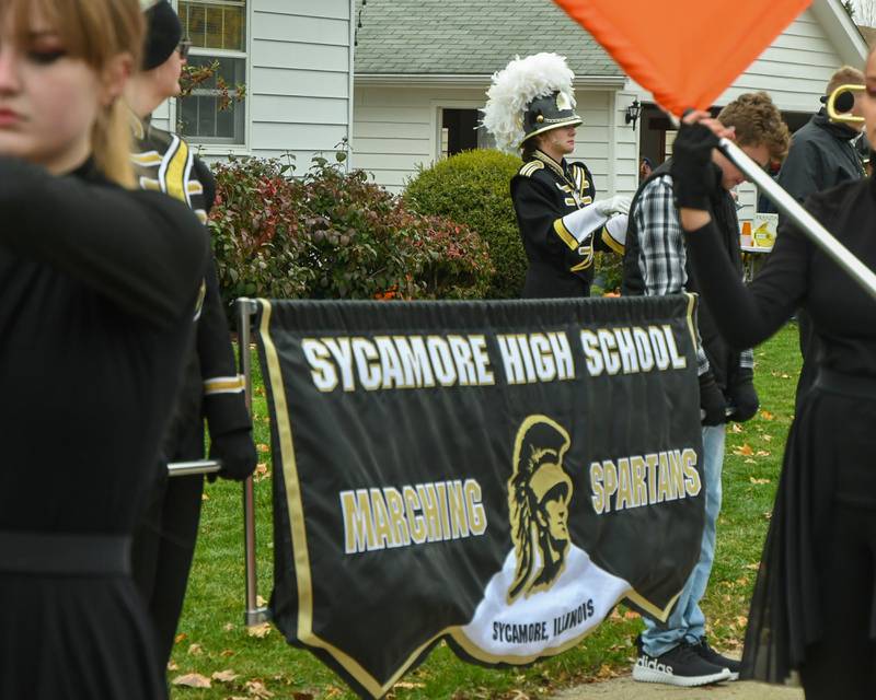 Sycamore High School senior and Drum major Averi Anderson helps warm up the Sycamore High School marching band before the start of the Sycamore Pumpkin Festival Pumpkin Parade held in downtown Sycamore on Sunday, Oct. 29, 2023.