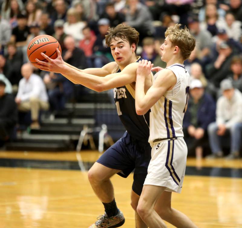 Harvest Christian Academy’s JJ Gonnam (left) tries to get around Serena’s Carson Baker during the Class 1A Harvest Christian Academy Sectional semifinal game on Wednesday, Feb. 28, 2024 in Elgin.