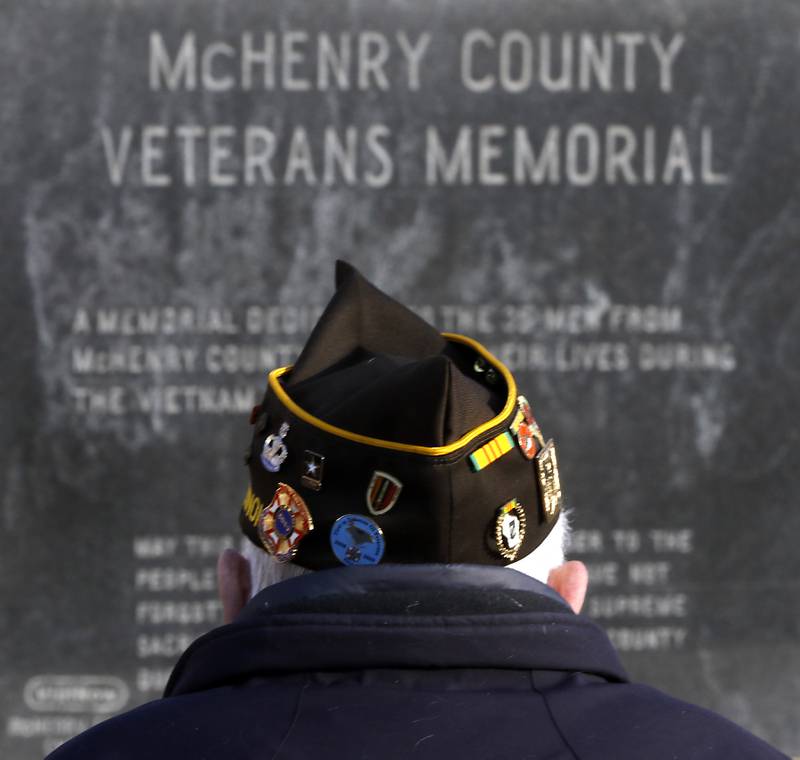 A veteran looks at the McHenry County Veterans Memorial during the “Voices from Vietnam,” program on Friday, March 29, 2024, at the McHenry County Government Administration Building in Woodstock. The program was the first time that McHenry County honored Vietnam veterans on Vietnam War Veterans Day. The day, that was created by federal law enacted in 2017, honors the more than 2.7 million American men and women who served in Vietnam.