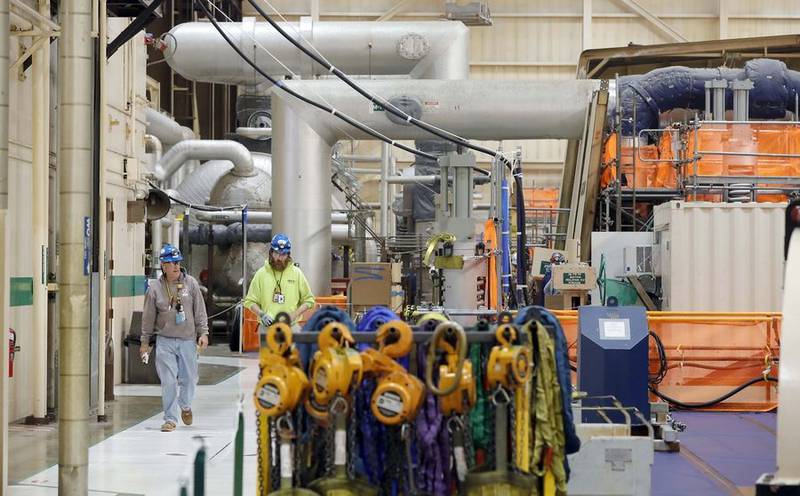 Employees in the turbine room of the Byron Generating Station Tuesday, Oct. 17, 2023, in Byron.