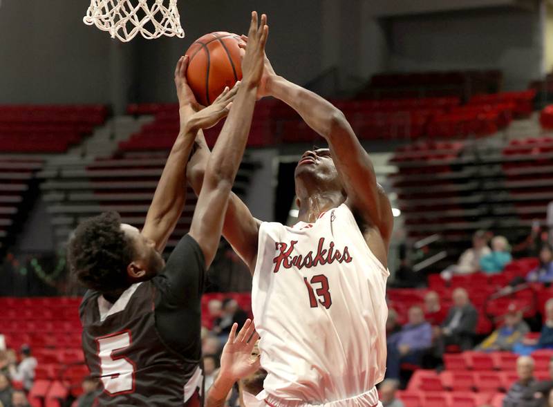 Northern Illinois' Xavier Amos shoots over Calumet's Colby Wiggins during their game Monday, Dec. 18, 2023, at the Convocation Center at NIU in DeKalb.