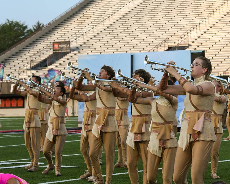 Part of the brass section of the Spartans drum corps from Nashua, New Hampshire, perform during the Drum Corps International Midwest Classic on Saturday, July 13, 2024, at Northern Illinois University Huskie Stadium in DeKalb.