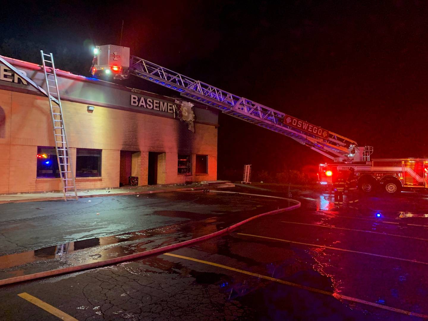 Fire truck outside the damaged Plainfield building.