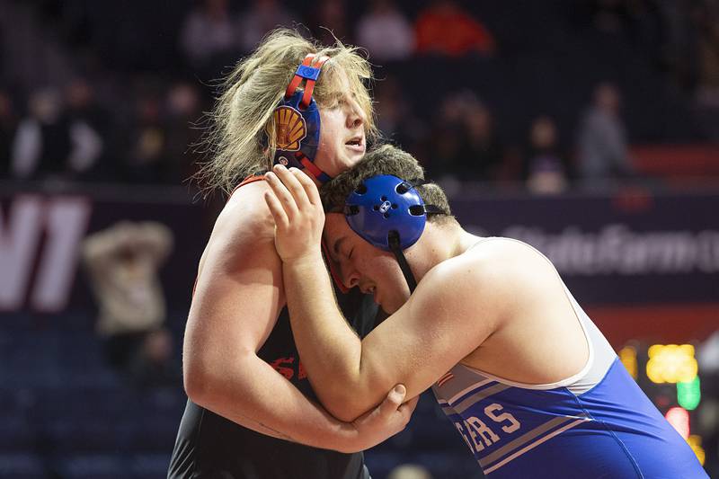 Princeton’s Cade Odell (right) works against Roxana’s James Herring in the 285 pound 1A third place match Saturday, Feb. 17, 2024 at the IHSA state wrestling finals at the State Farm Center in Champaign.