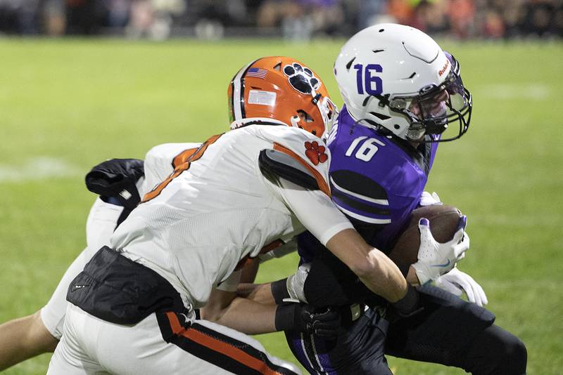 Dixon’s James Simpson is pushed out of bounds by Byron’s Dylan Springer Friday, Oct. 18, 2024, at A.C. Bowers Field in Dixon.