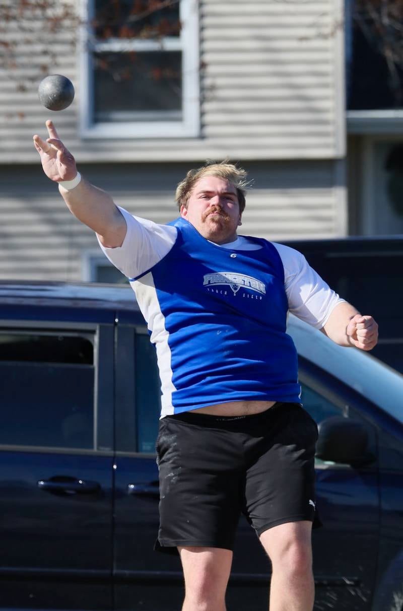 Princeton's Payne Millers puts his might into the shot put in Tuesday's Howard-Monier Invite.