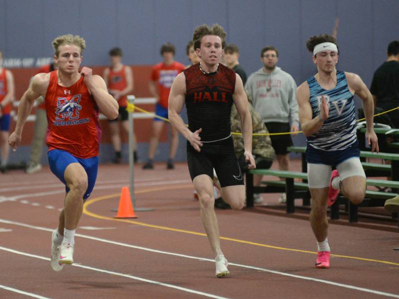 Hall's Caleb Bickett (center) and Bureau Valley's Brady Hartz (right) run in the finals of the 60 meters dash at the Westwood Sports Center in Sterling on Tuesday, March 26, 2024. They are among the top returning area sprinters.