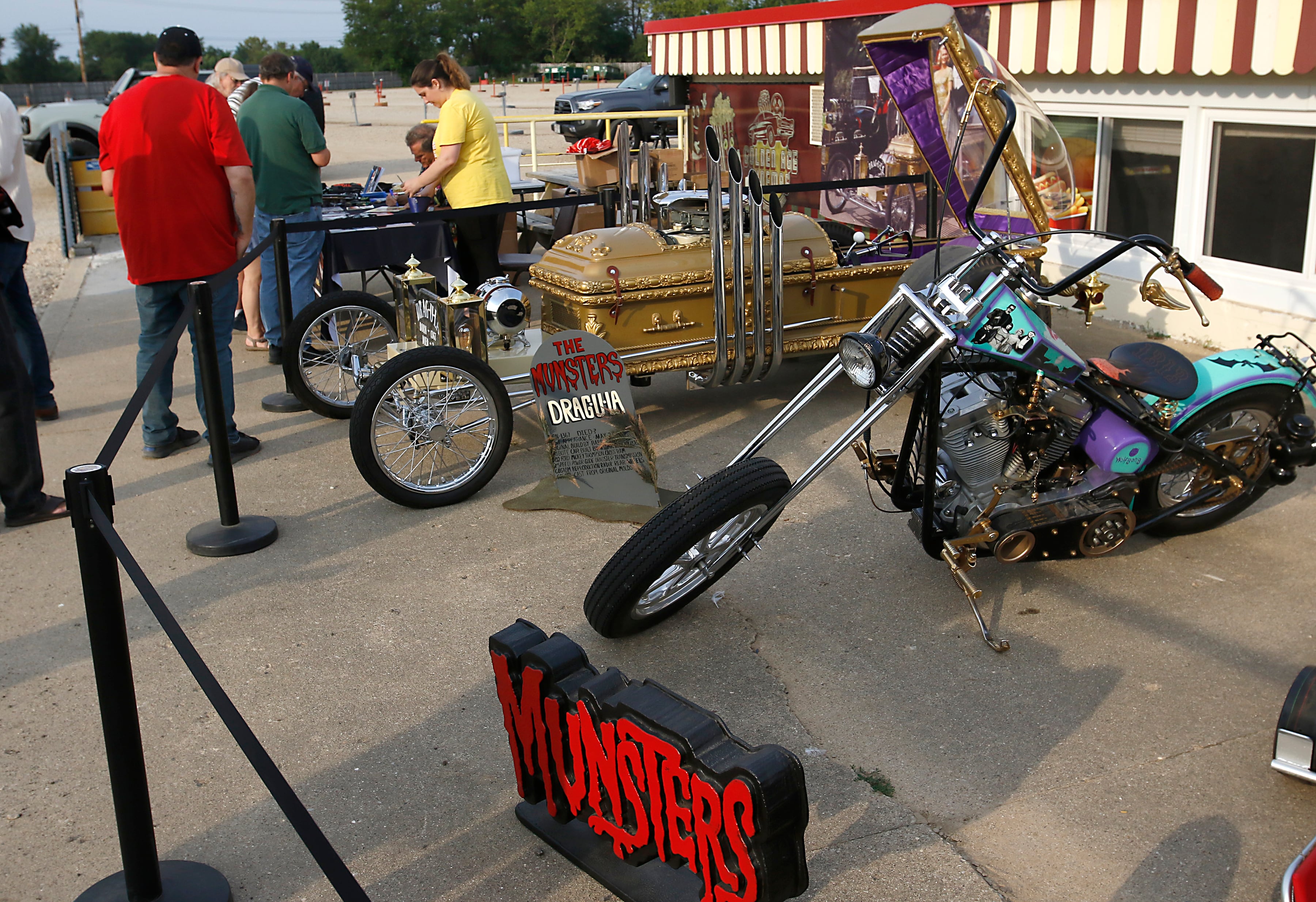 Butch Patrick, who played Eddie Munster on the 1960s show “The Munsters” signs autographs, Wednesday, Aug. 14, 2024, during an appearance at the McHenry Outdoor Theater.