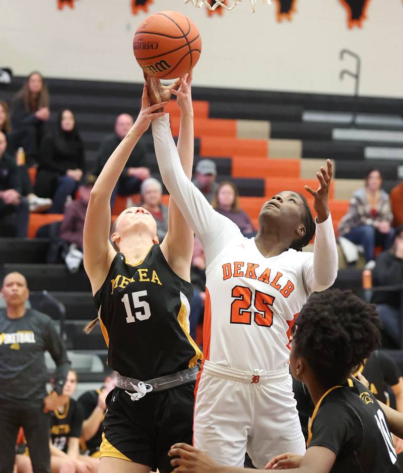 DeKalb’s Kezaria Mitchell and Metea Valley's Kelly Clish go after a rebound during their game Friday, Jan. 19, 2024, at DeKalb High School.