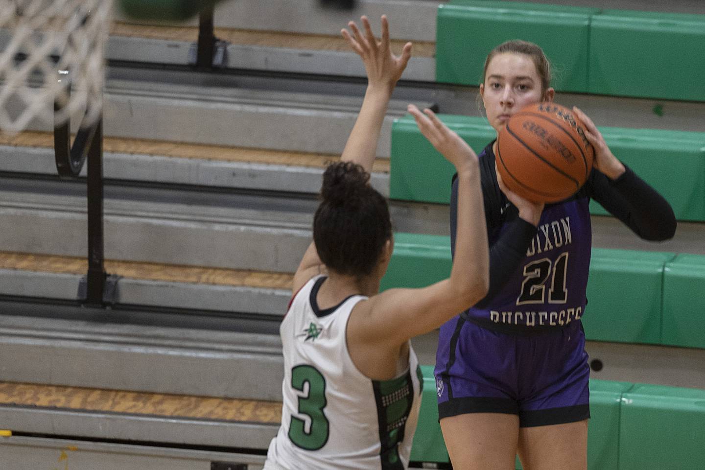 Dixon’s Reese Dambman puts up a three point shot against Rock Falls’ Autumn Weatherby Wednesday, Jan. 31, 2024 at Rock Falls High School.