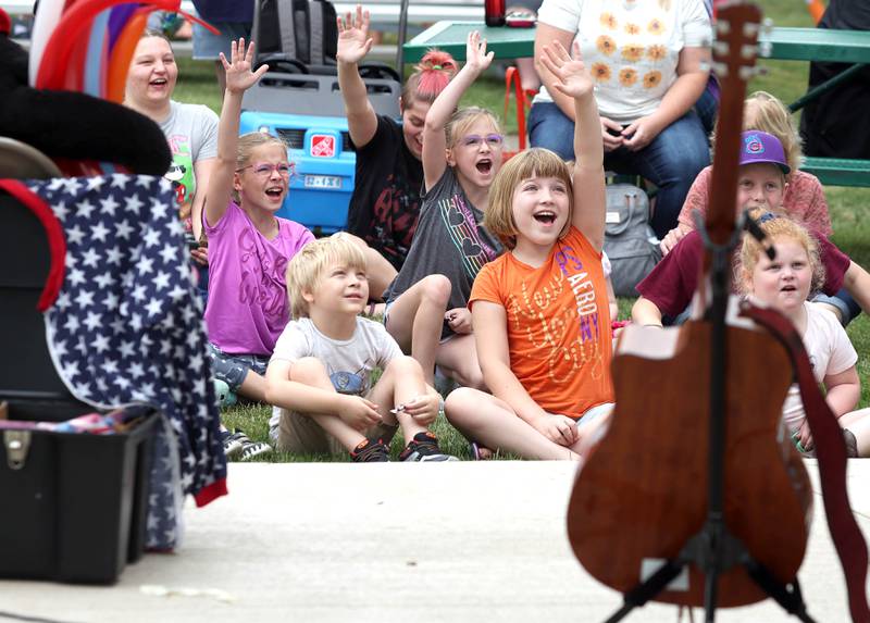 Kids volunteer to help out during the Mr. Steve show Saturday, July 16, 2022, at the Waterman Lions Summerfest and Antique Tractor and Truck Show at Waterman Lions Club Park.