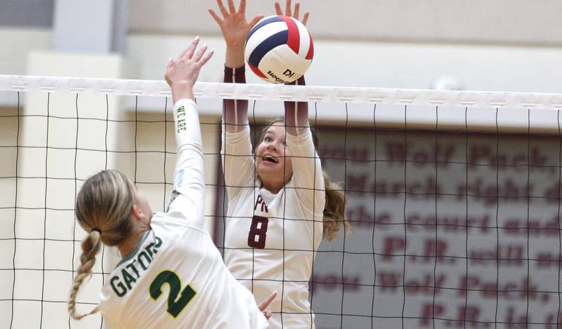 Prairie Ridge’s Brynn Palmer, right, blocks Crystal Lake South’s Kendall Brandt in varsity girls volleyball on Thursday, Aug. 29, 2024, at Prairie Ridge High School in Crystal Lake.