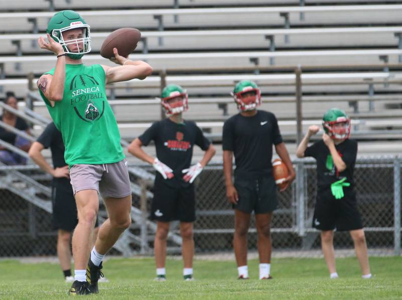 Seneca quarterback Paxton Giertz throws a pass during a 7-on-7 meet against L-P on Wednesday, July 10, 2024 at Seneca High School.