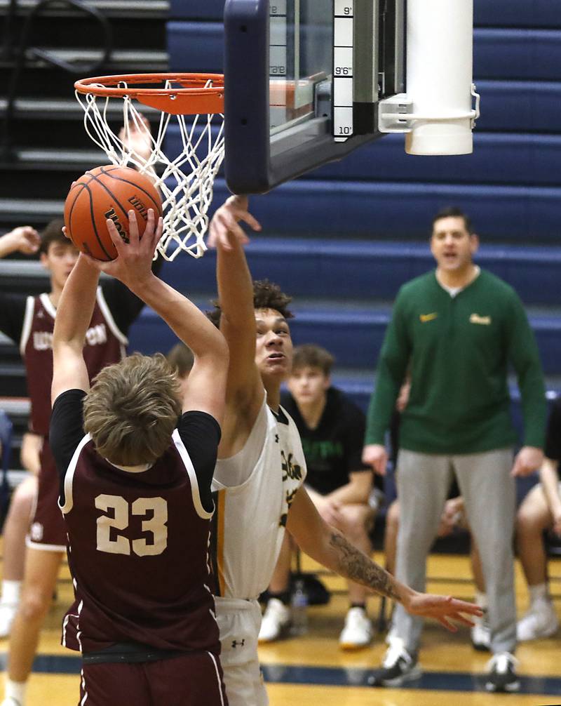 Crystal Lake South's Cooper Buelna tries to block the shot of Wheaton Academy's Hayden Schroeder during the IHSA Class 3A Cary-Grove Boys Basketball Regional Championship game on Friday, Feb. 23, 2024 at Cary-Grove High School.