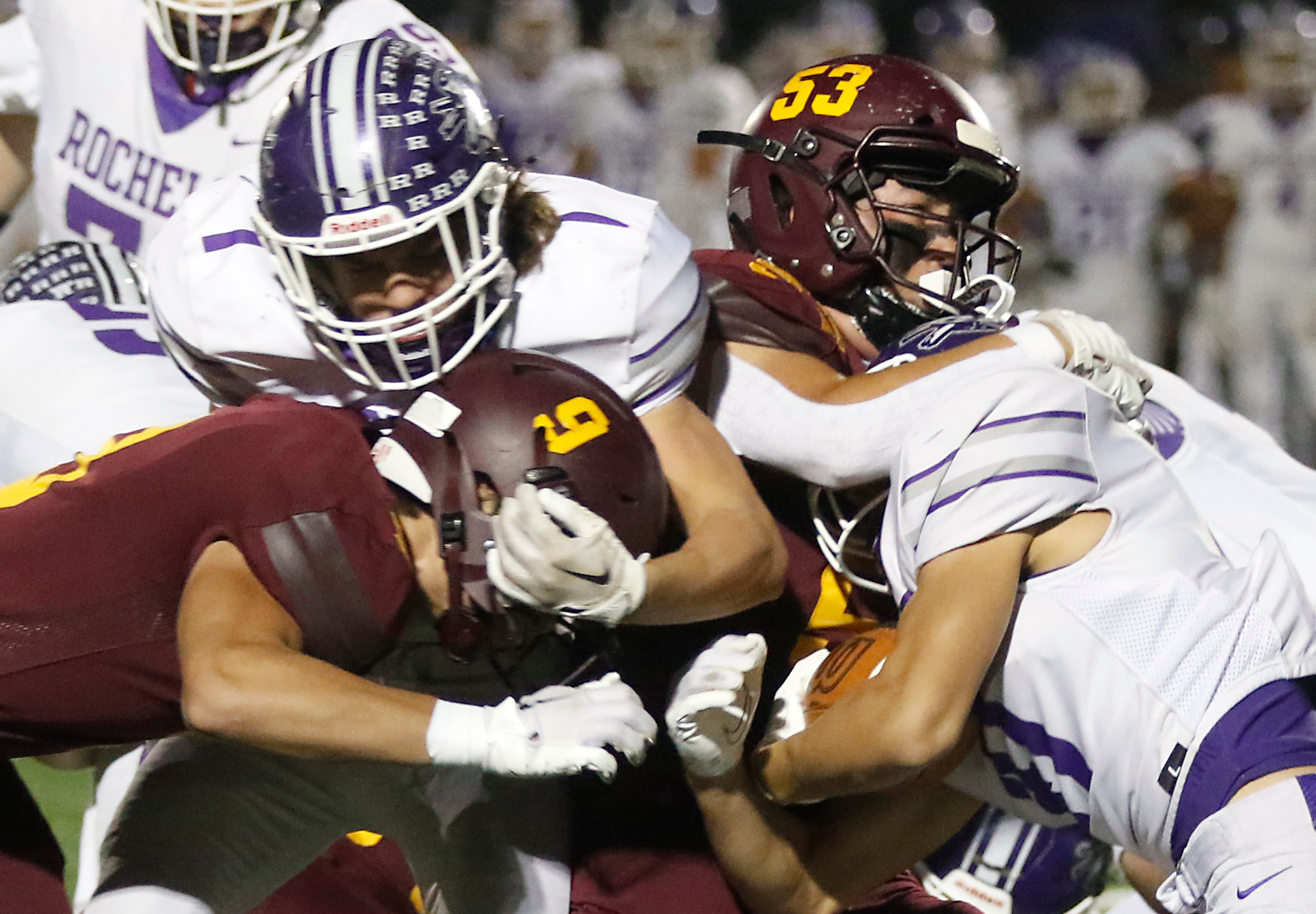 Richmond-Burton's Logan Garcia tackles Rochelle's Dylan Manning and Rochelle's Grant Gensler grabs Richmond-Burton's Daniel Kalinowski during a Kishwaukee River Conference football game on Friday, Oct.20, 2023, at Richmond-Burton High School.