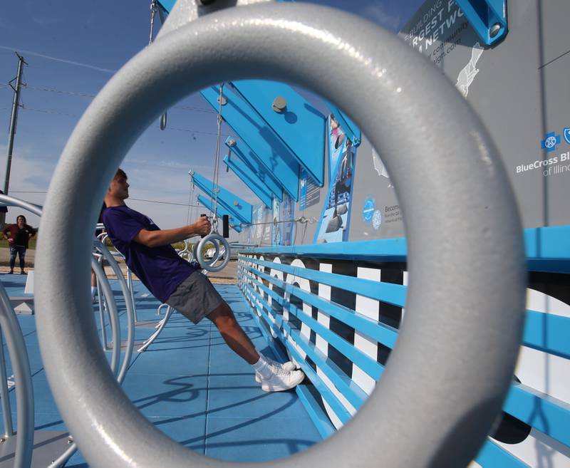 IVCC soccer player Rutger Noordegraff demonstrates how to use a portion of the new outdoor fitness court on Wednesday, Sept. 18, 2024 at Rotary Park in La Salle.