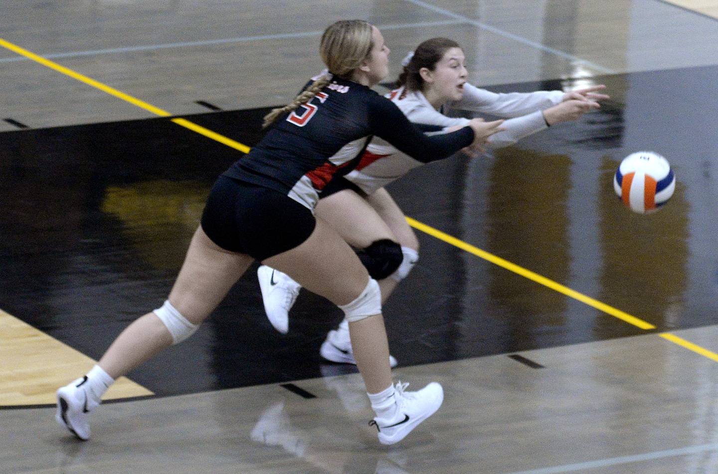 Woodland's Clara Downey (5) and Kaiden Connor chase a Putnam County shot Thursday, Aug. 25, 2022, in Granville.