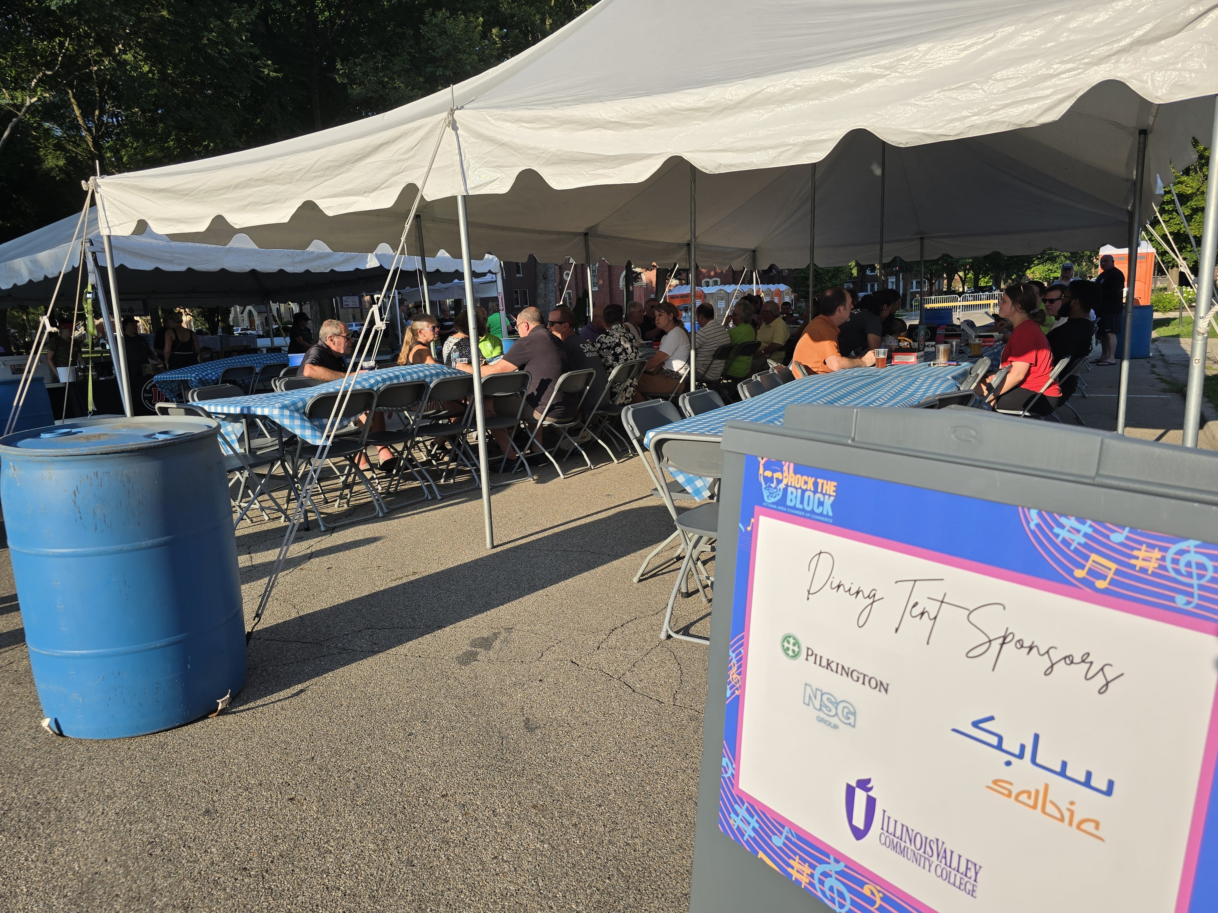 The dining tent was a shady sanctuary Wednesday, July 31, 2024, during the Rock the Block event on Jackson Street in Ottawa.