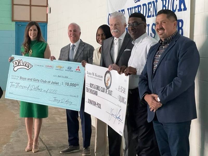 Will County State’s Attorney James Glasgow and Joliet Mayor Terry D’Arcy each donated $10,000 to help operate and maintain the 12-foot, Olympic-sized pool at the Boys and Girls Club of Joliet.
Pictured, from left, is Kelly Rohder-Tonelli, president of the Boys and Girls Club of Joliet board of directors; Joliet Mayor Terry D'Arcy; Chantel Gamboa, executive director of the Boys and Girls Club of Joliet, Will County State's Attorney James Glasgow; Albert Bailey, information technology specialist for the Will County State’s Attorney’s office; and Cesar Cardenas, city of Joliet council member, District 4.