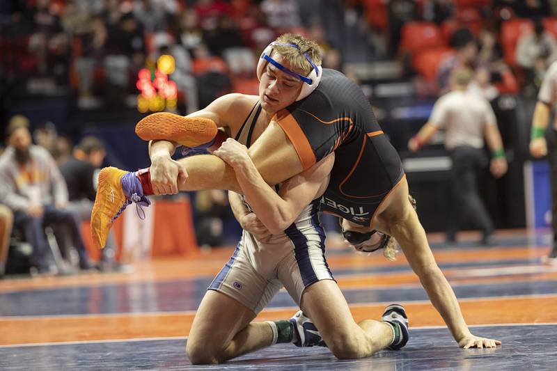 Sterling Newman Central’s Brady Grennan controls Richland’s Carson Bissey in the 132 pound 1A third place match Saturday, Feb. 17, 2024 at the IHSA state wrestling finals at the State Farm Center in Champaign.