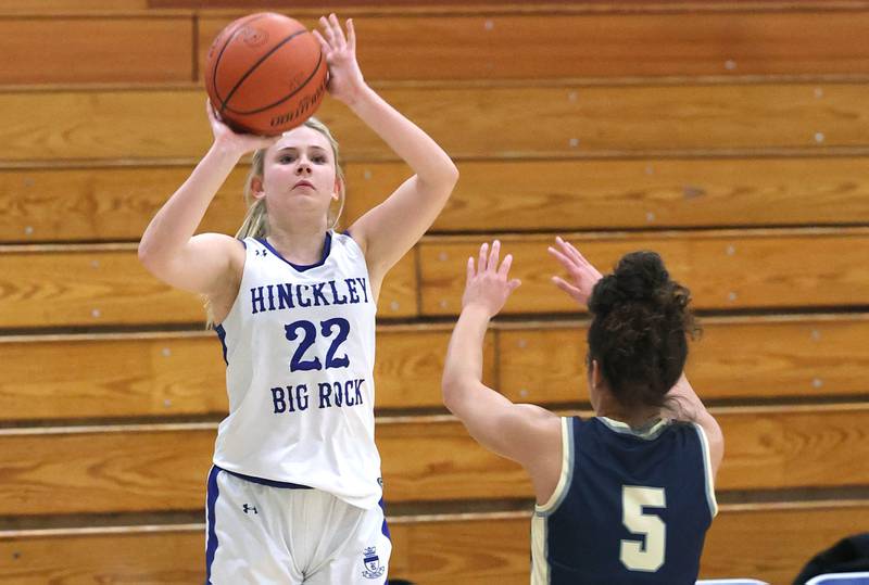 Hinckley-Big Rock’s Anna Herrmann shoots a three pointer over Harvest Christian’s Daphne Brown Monday, Jan. 8, 2023, during their game at Hinckley-Big Rock High School.