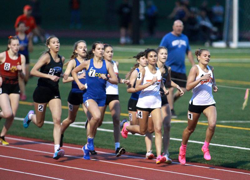 St. Charles East’s Marley Andelman (far right) leads the 800-meter run during the DuKane Conference Girls Outdoor Championships at Lake Park in Roselle on Thursday, May 2, 2024.