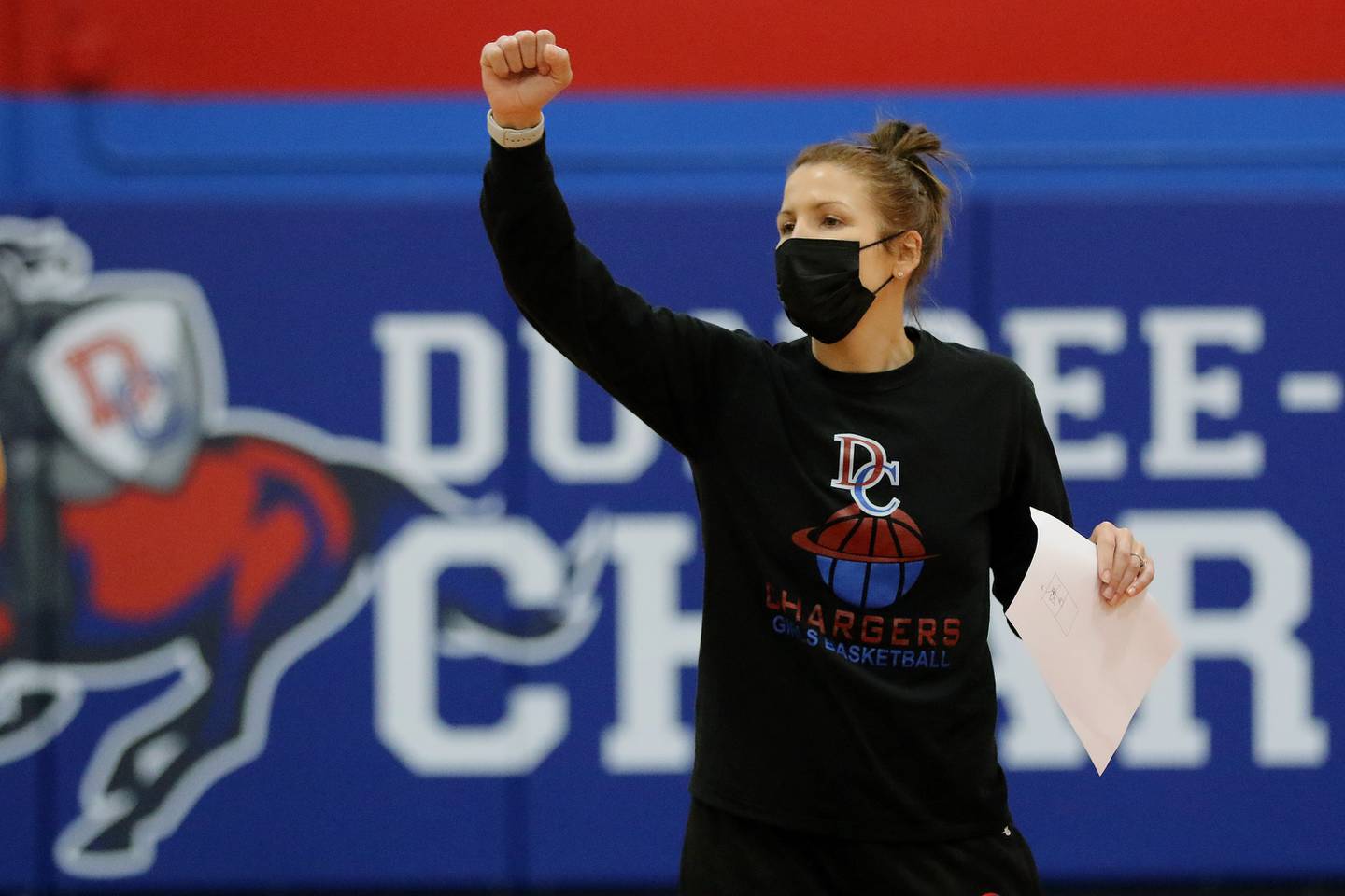 Coach Sarah Teipel talks with the team during girls basketball practice at Dundee-Crown High School on Tuesday, Feb. 2, 2021in Carpentersville.