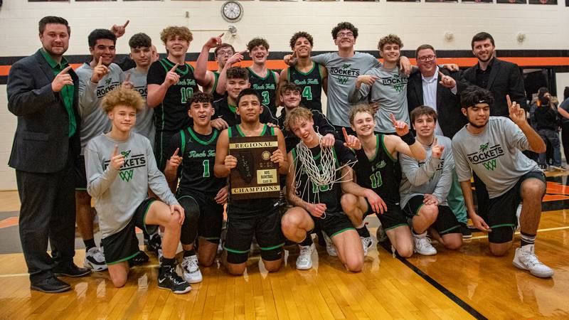 The Rock Falls Rockets pose with the Byron Regional championship plaque after beating Byron 43-40 to take the title on Saturday, Feb. 25, 2023.