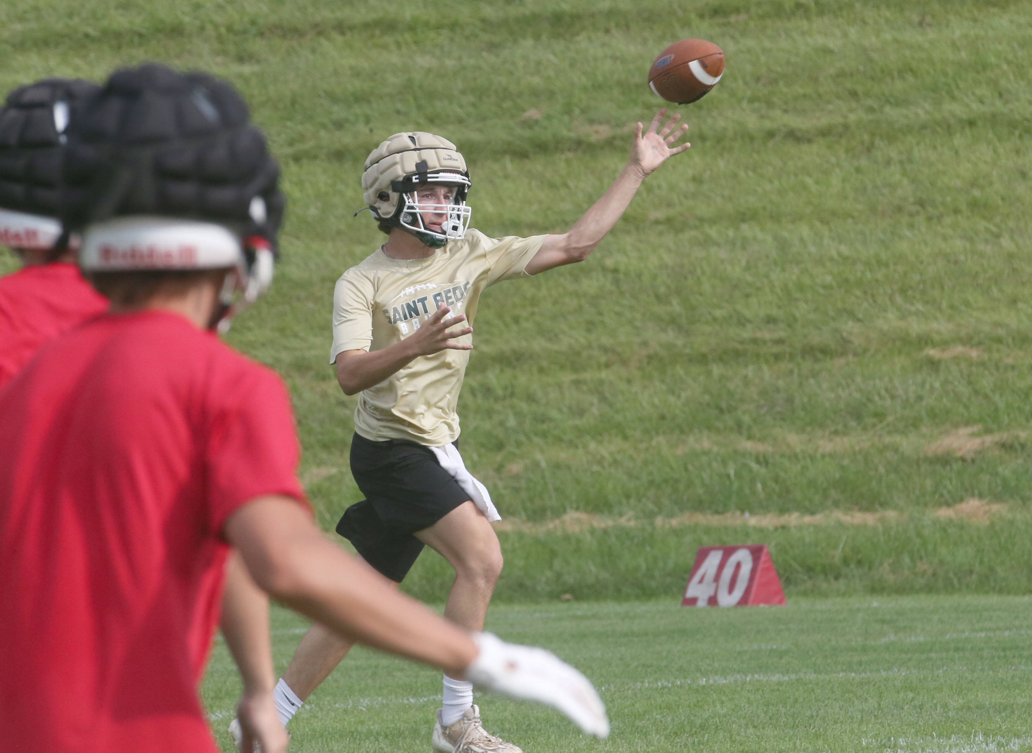 St. Bede quarterback Gino Ferrari throws a pass against Ottawa during a 7-on-7 meet on Wednesday, July 24, 2024 at Ottawa High School.