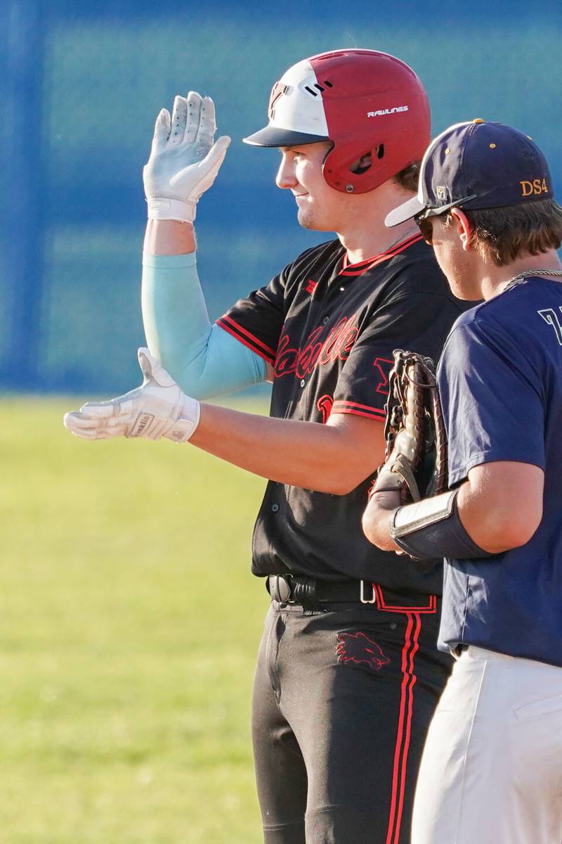 Yorkville's Nate Harris (15) reacts after hitting an RBI double against Neuqua Valley during a Class 4A Neuqua Valley Regional semifinal baseball game at Neuqua Valley High School in Naperville on Thursday, May 23, 2024.